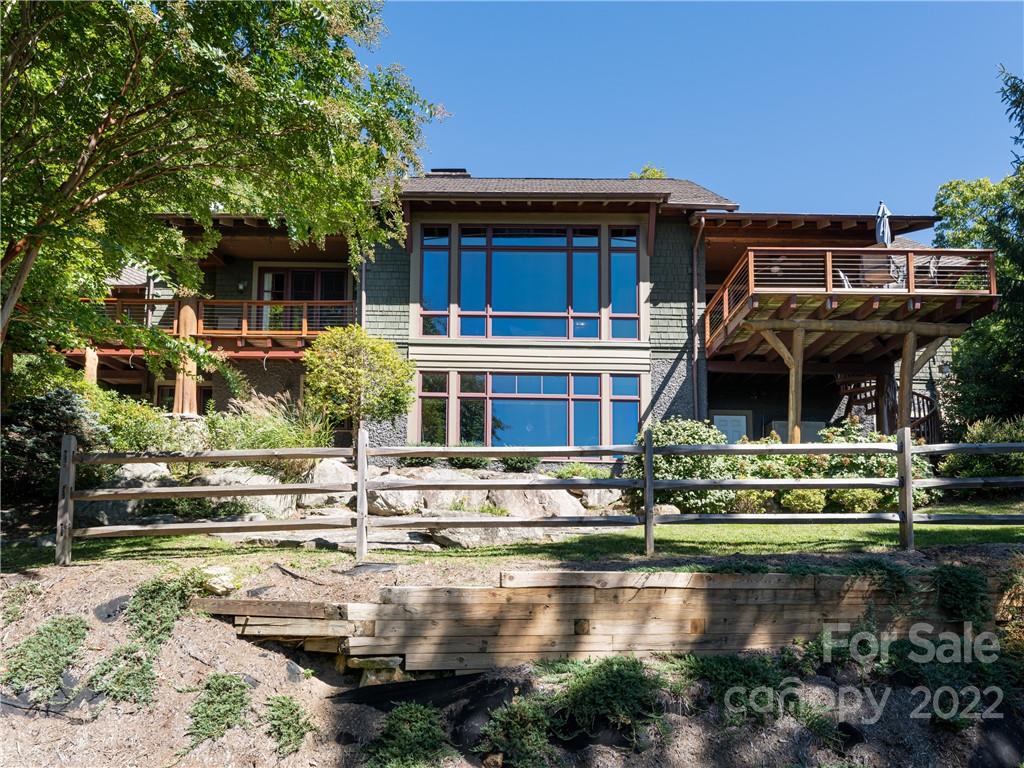168 Pinkerton Corner Fairview, NC 28730 - Photo 46 of 48 a front view of a house with a yard table and chairs