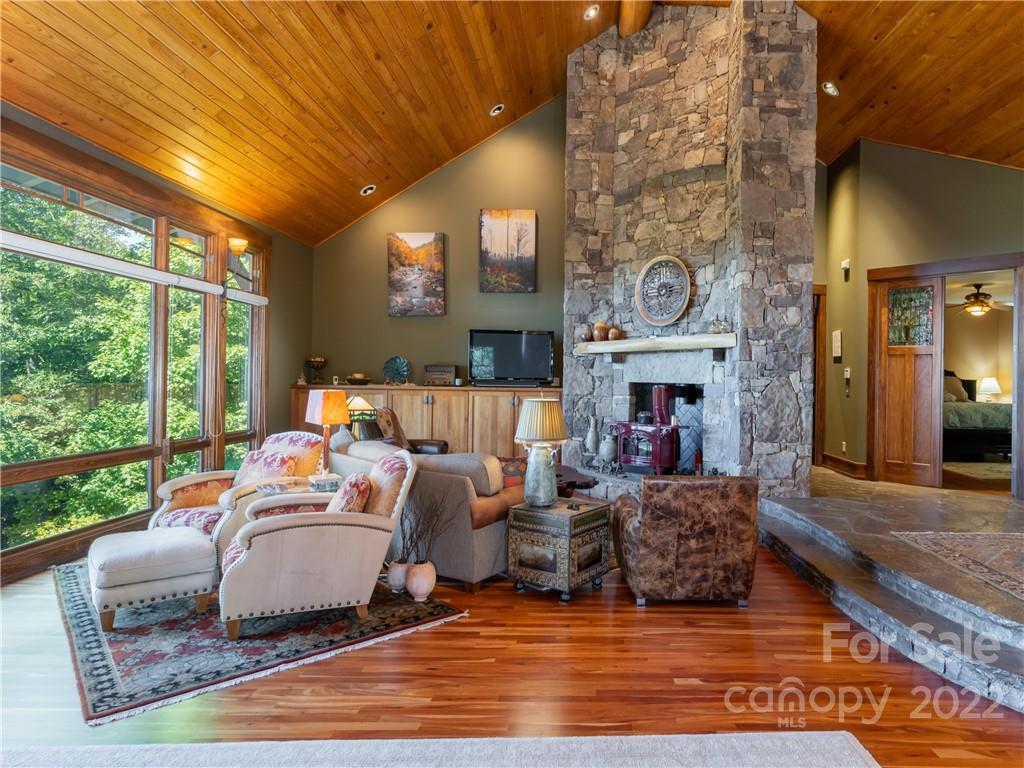 168 Pinkerton Corner Fairview, NC 28730 - Photo 10 of 48 a living room with fireplace furniture and a large window