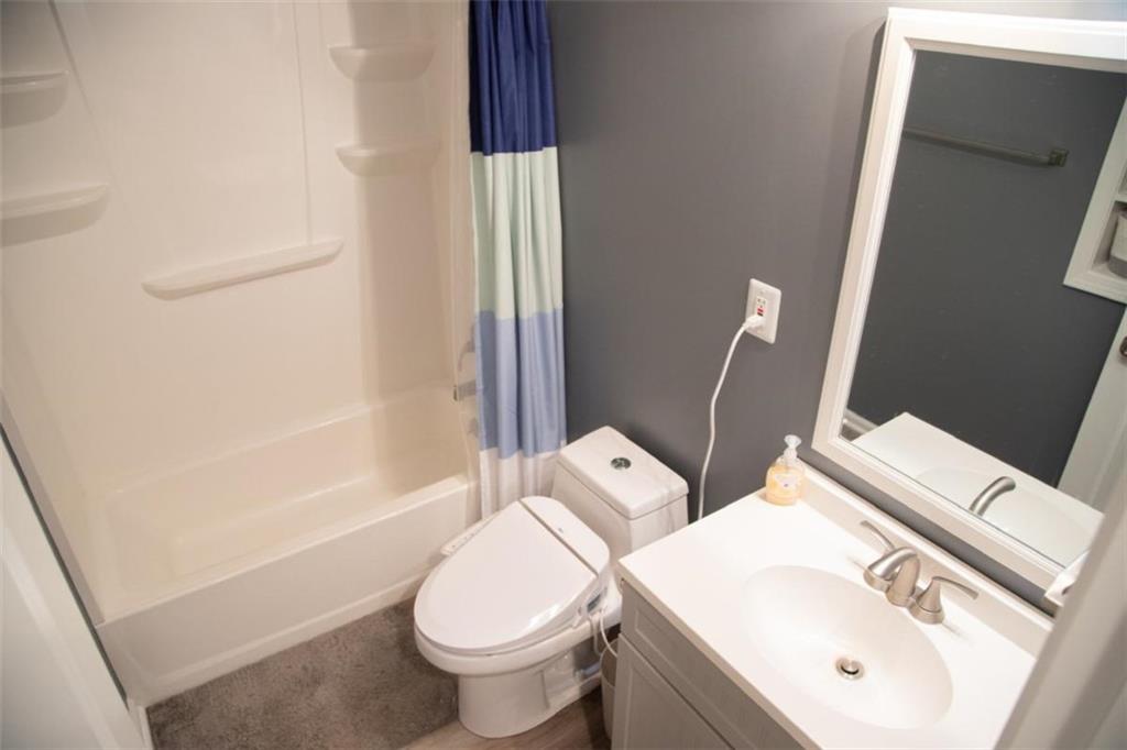 571 Oak Grove Road McDonough, GA 30253 - Photo 12 of 31 a bathroom with a sink and a mirror