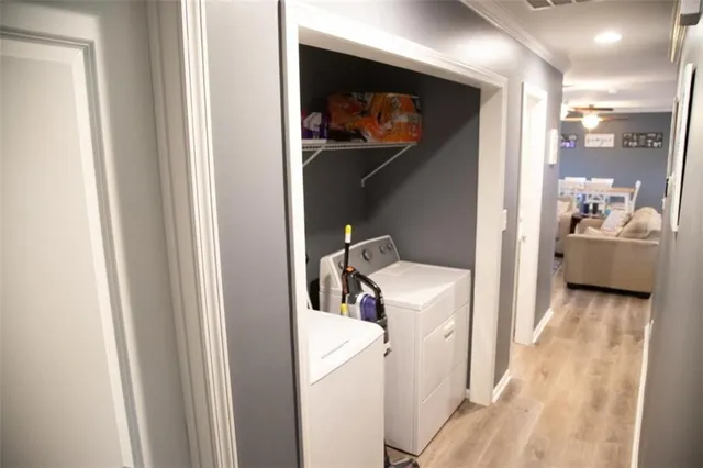 a bedroom with a bed and a flat tv screen on a dresser