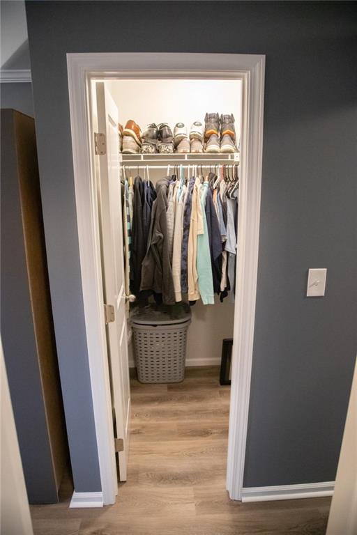 571 Oak Grove Road McDonough, GA 30253 - Photo 19 of 31 a view of walk in closet with clothes and shoes
