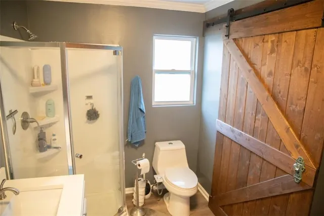 a bedroom with a bed and a desk