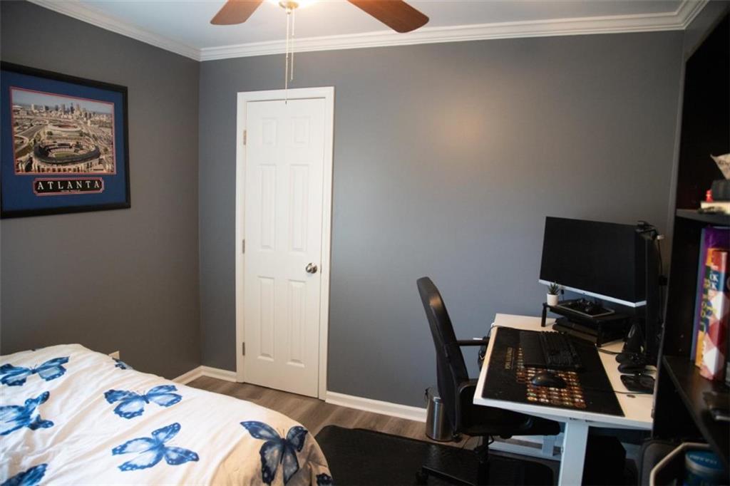 571 Oak Grove Road McDonough, GA 30253 - Photo 22 of 31 a bedroom with a bed and a desk