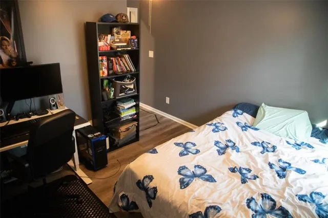 a bedroom with furniture and a window