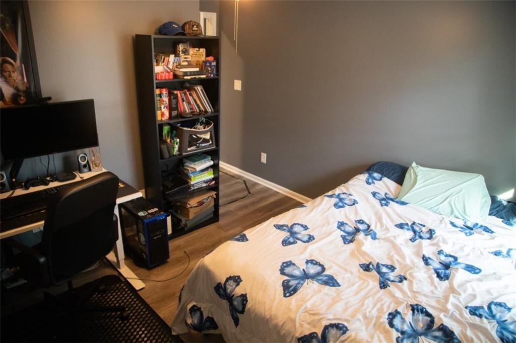 571 Oak Grove Road McDonough, GA 30253 - Photo 24 of 31 a bedroom with a bed and a television