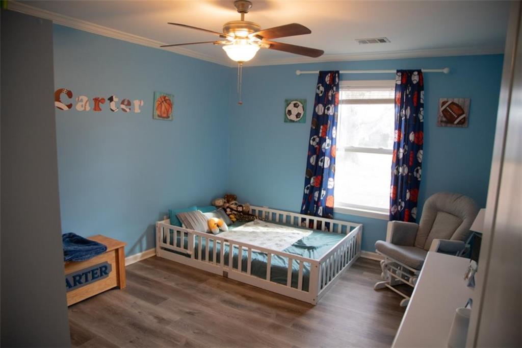 571 Oak Grove Road McDonough, GA 30253 - Photo 25 of 31 a bedroom with furniture and a window
