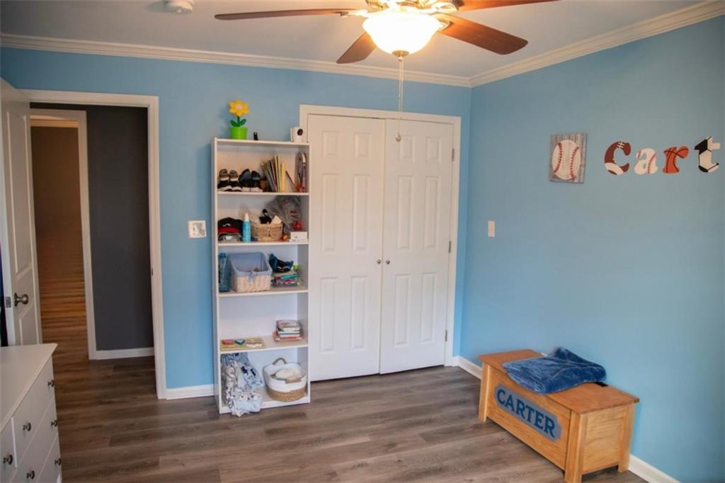 571 Oak Grove Road McDonough, GA 30253 - Photo 26 of 31 a room with toys and wooden floor