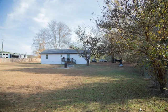 a view of a large body of water with a house in the background