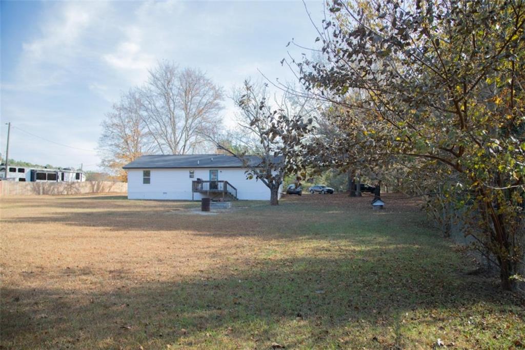 571 Oak Grove Road McDonough, GA 30253 - Photo 29 of 31 a view of a house with a yard