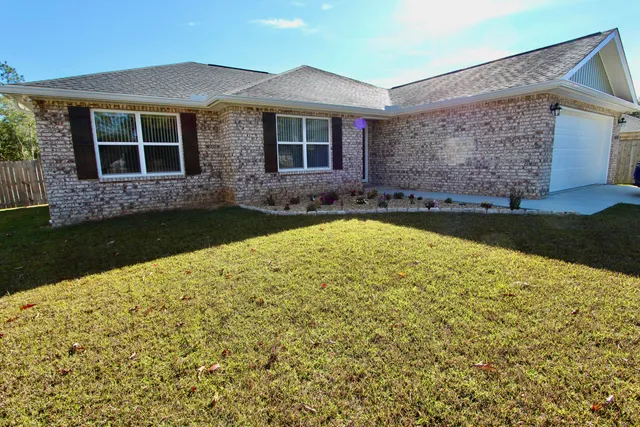 front view of a house with a yard