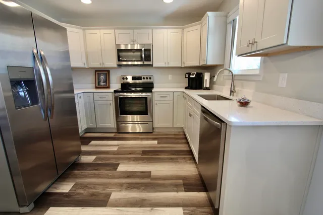 a kitchen with a sink and cabinets