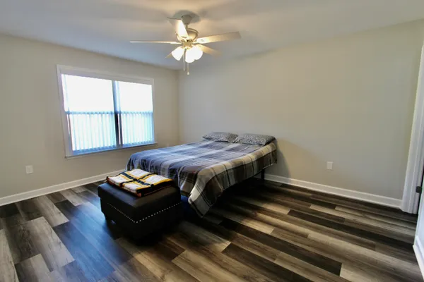 a bedroom with a bed and window