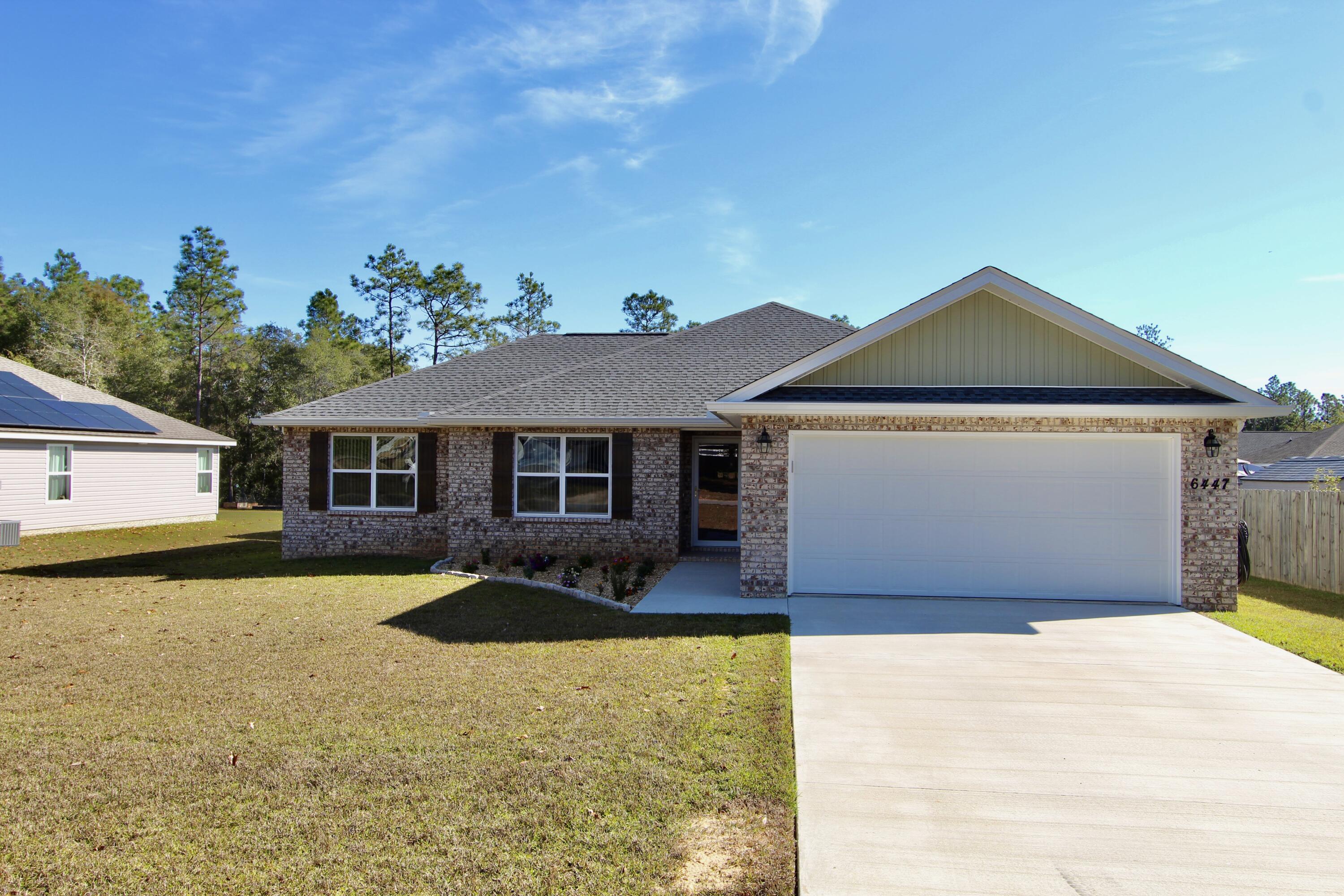 6447 Georgia Avenue Crestview, FL 32539 - Photo 2 of 36 a front view of a house with yard