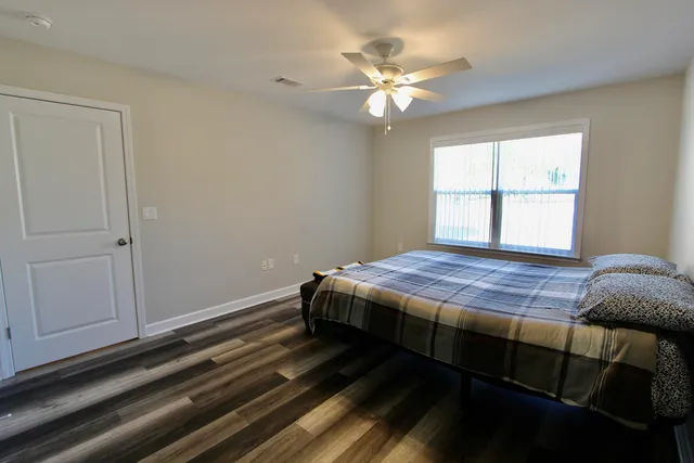 a bathroom with a sink toilet and mirror