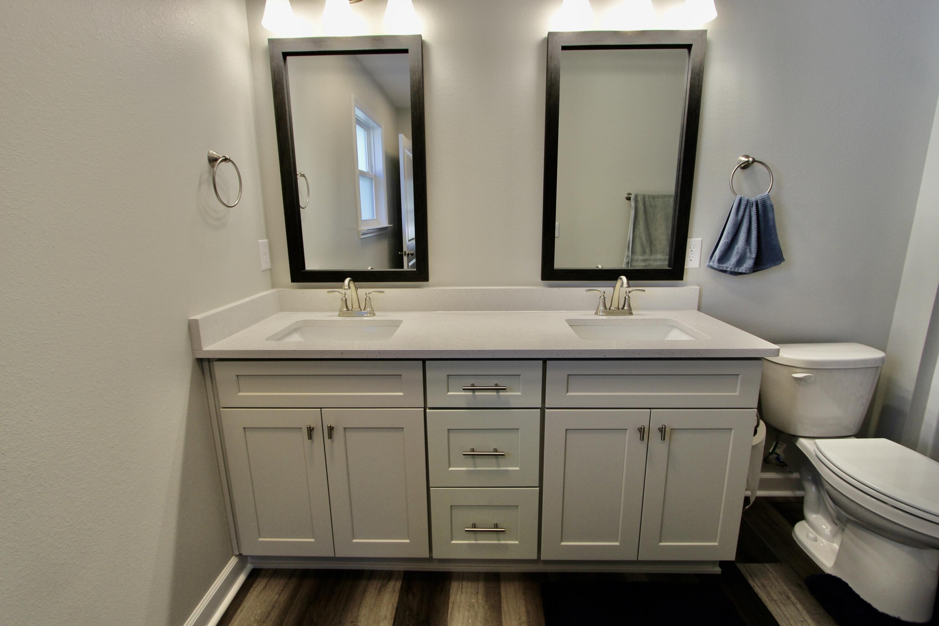6447 Georgia Avenue Crestview, FL 32539 - Photo 23 of 36 a bathroom with a toilet sink and mirror