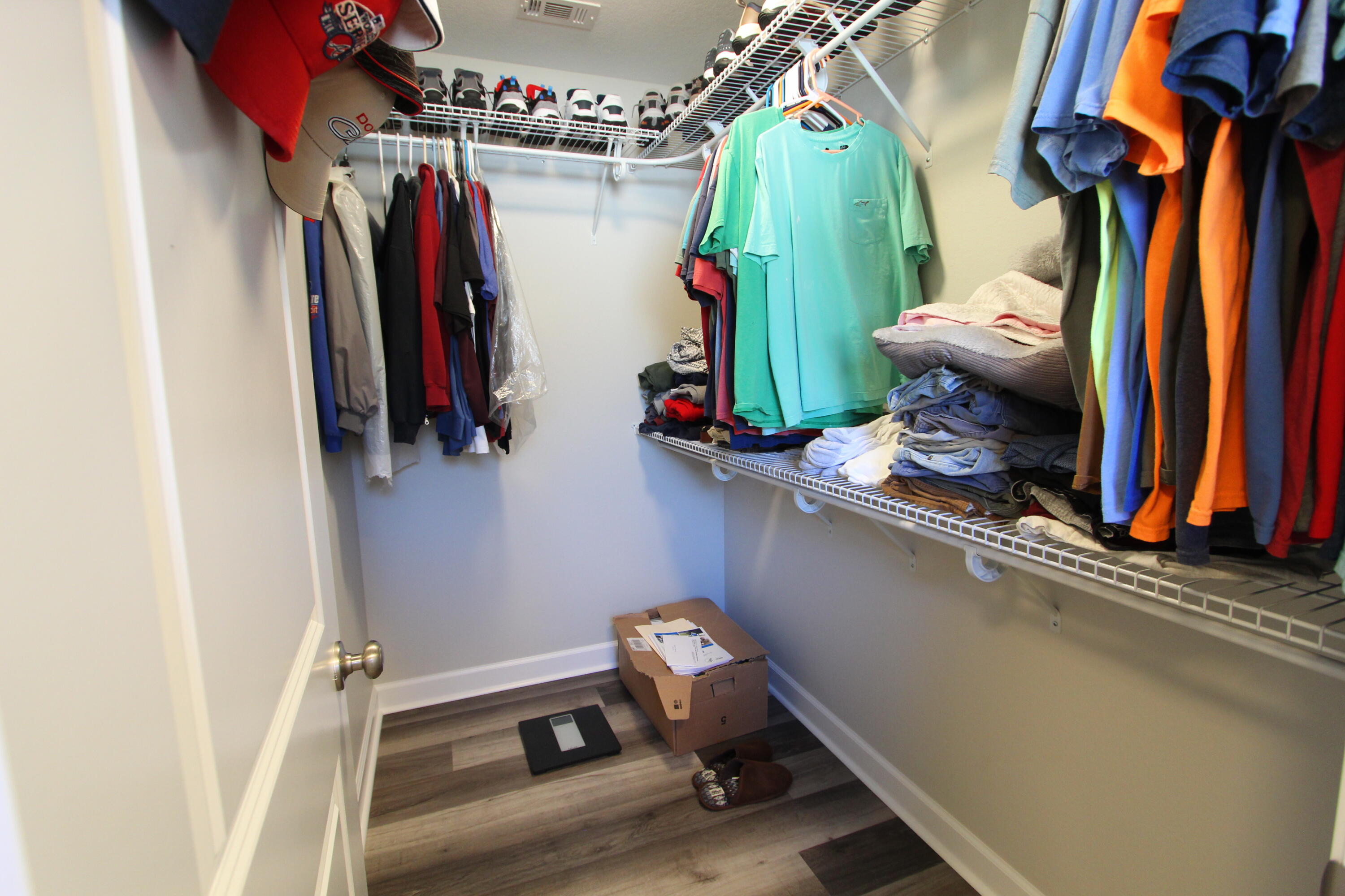 6447 Georgia Avenue Crestview, FL 32539 - Photo 24 of 36 a view of walk in closet with clothes and shoes