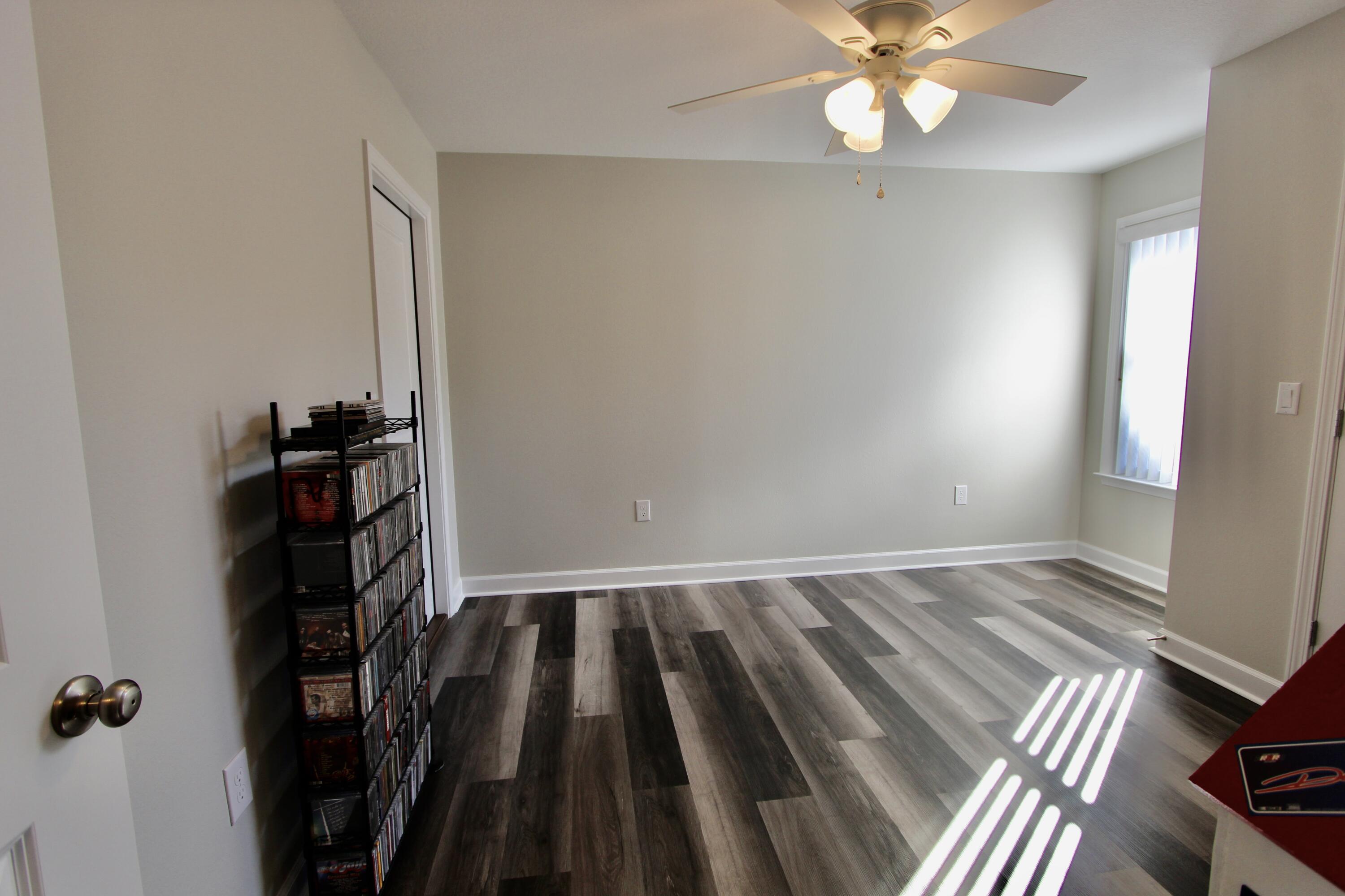 6447 Georgia Avenue Crestview, FL 32539 - Photo 25 of 36 wooden floor in an empty room