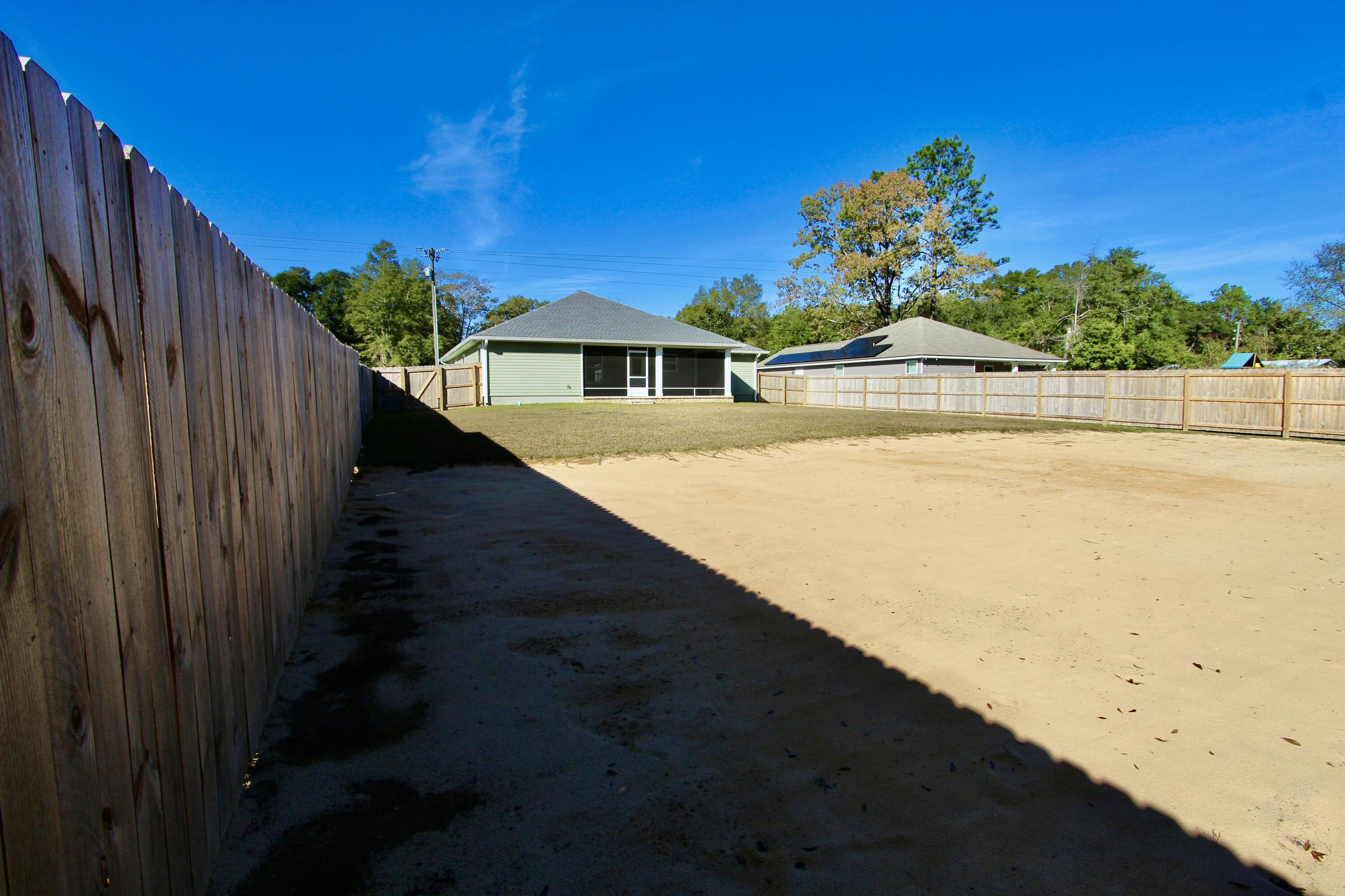 6447 Georgia Avenue Crestview, FL 32539 - Photo 32 of 36 a view of a house with a yard