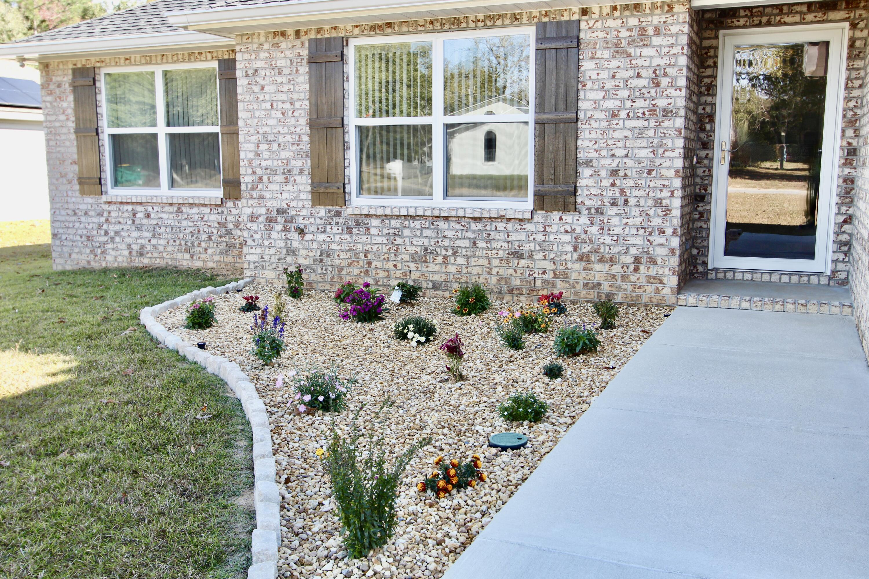 6447 Georgia Avenue Crestview, FL 32539 - Photo 7 of 36 a white bath tub sitting in front of a house