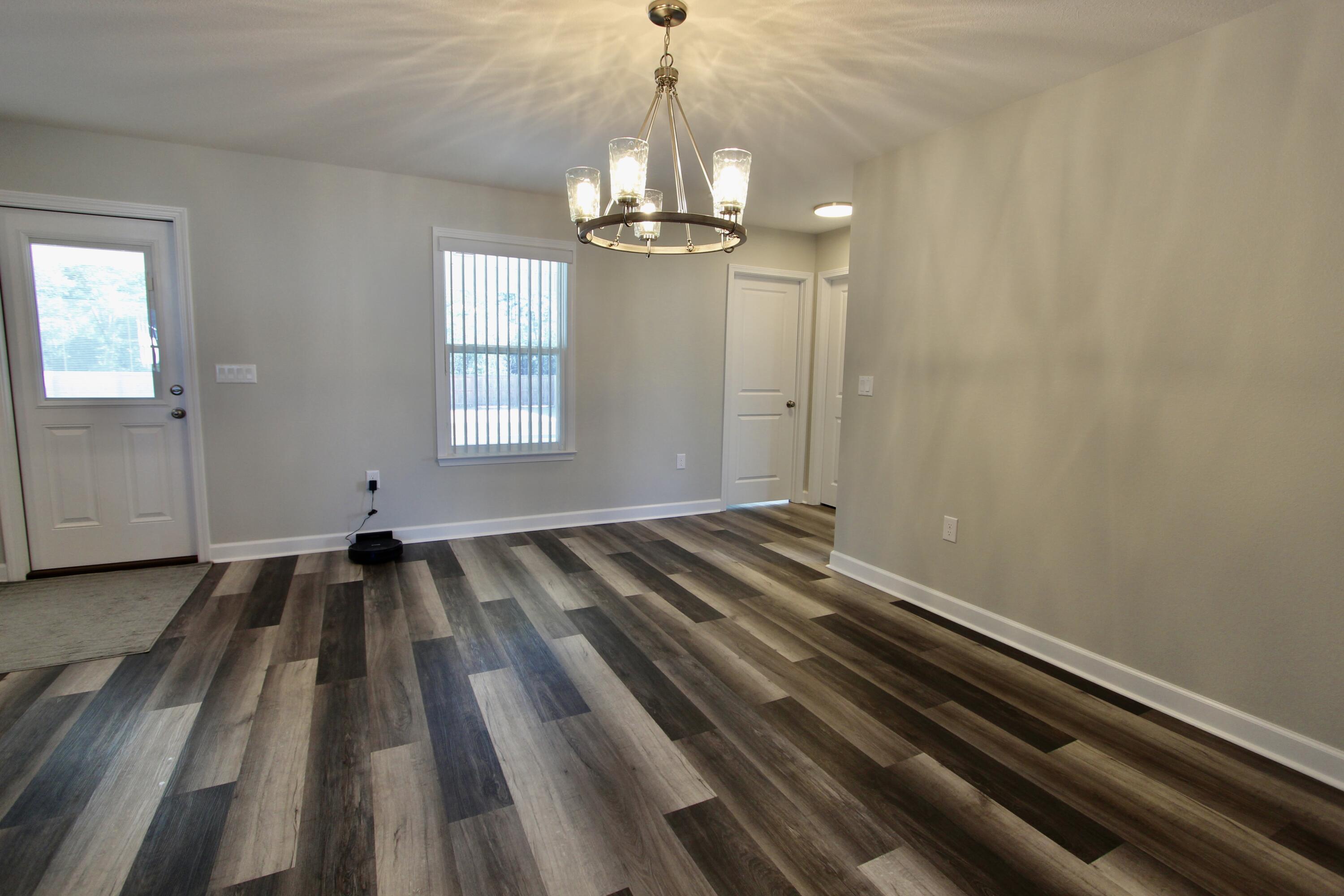 6447 Georgia Avenue Crestview, FL 32539 - Photo 9 of 36 a view of a livingroom with a chandelier