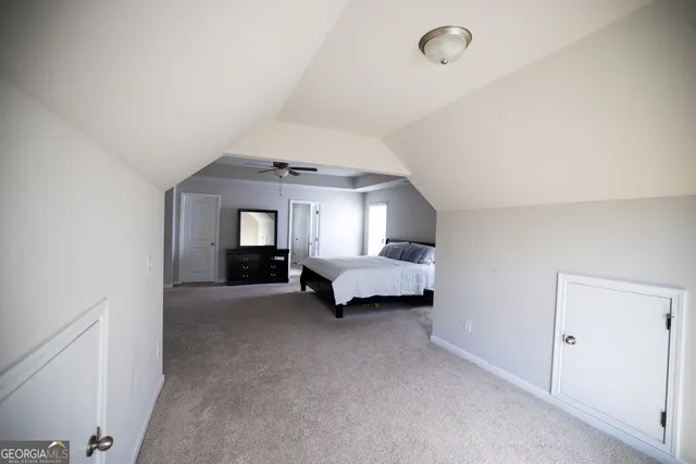 a view of a livingroom and a balcony