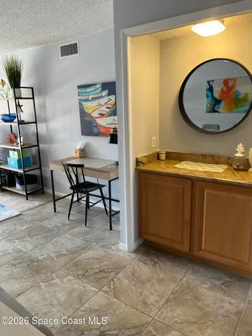 a view of a livingroom with furniture and cabinet