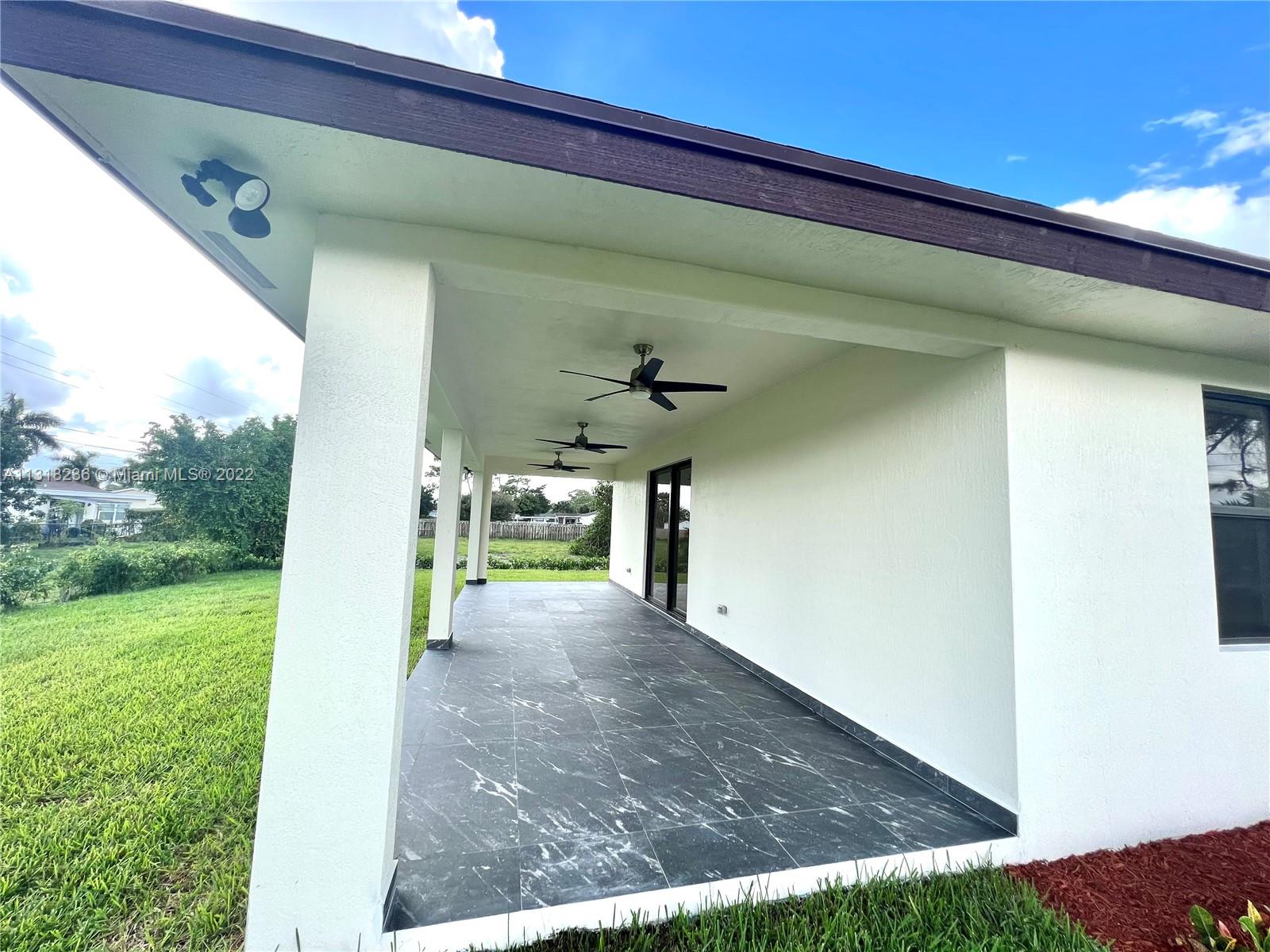 964 Rutherford Lane Haverhill, FL 33415 - Photo 6 of 18 a view of a porch