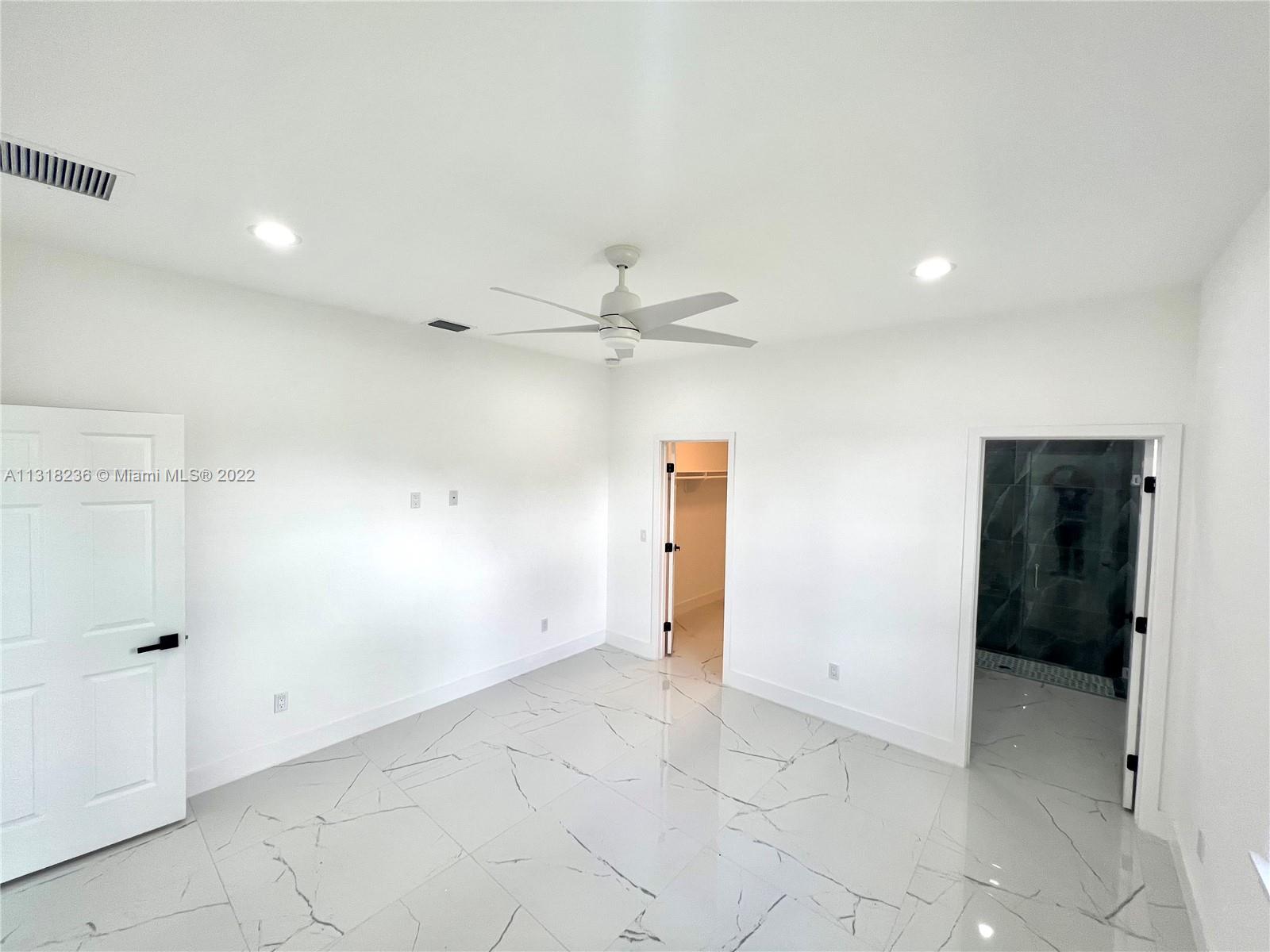964 Rutherford Lane Haverhill, FL 33415 - Photo 10 of 18 wooden floor in an empty room