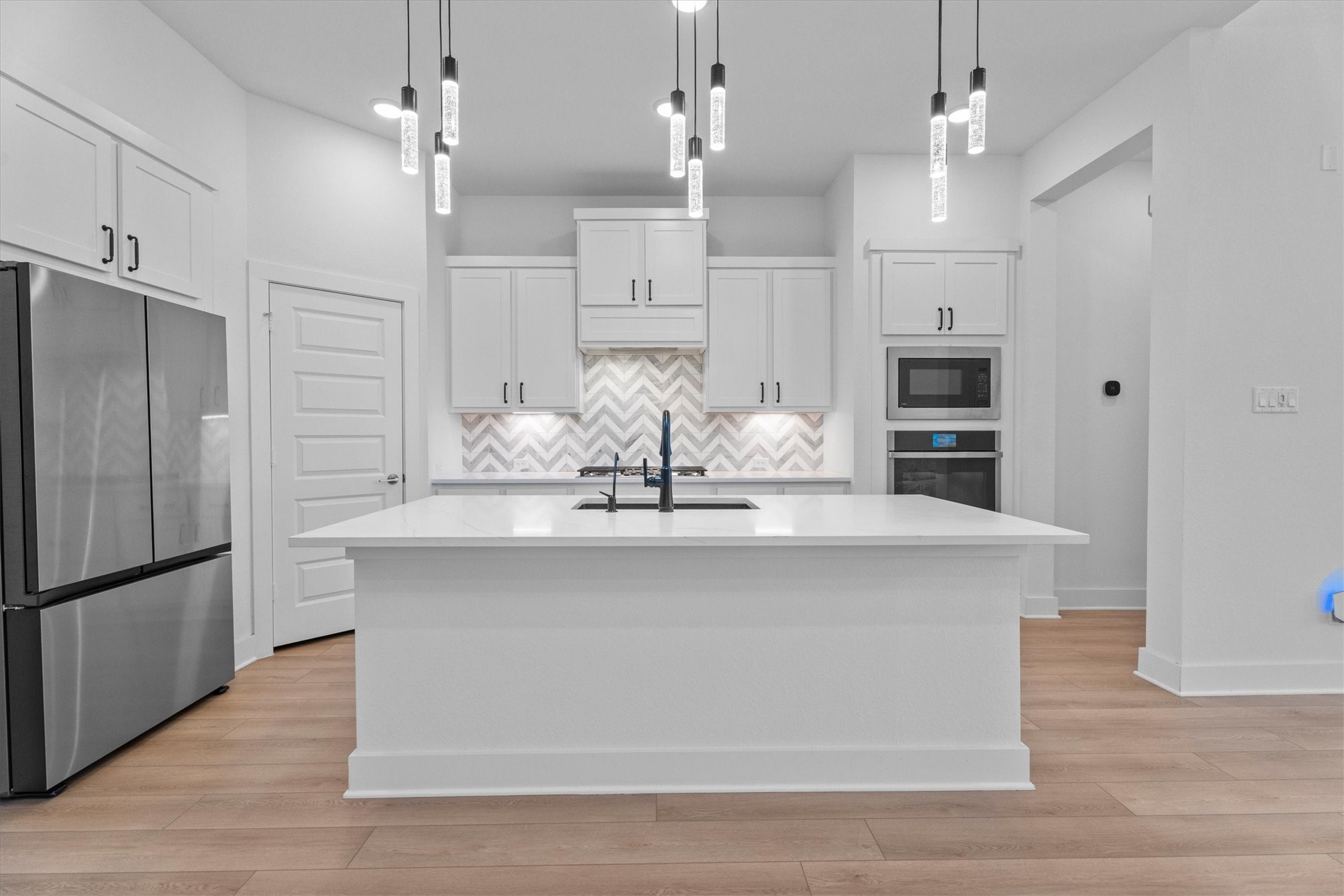 5030 Vly Wind Court Spring, TX 77386 - Photo 10 of 36 High-end Fridge stays with the rental. Gorgeous upgraded lighting.
