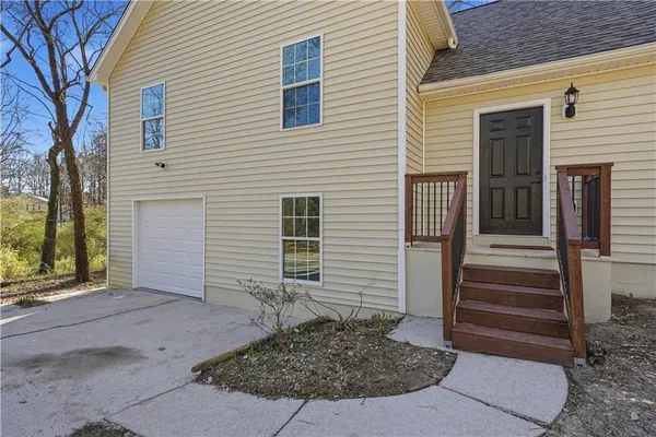 a view of a house with entrance gate