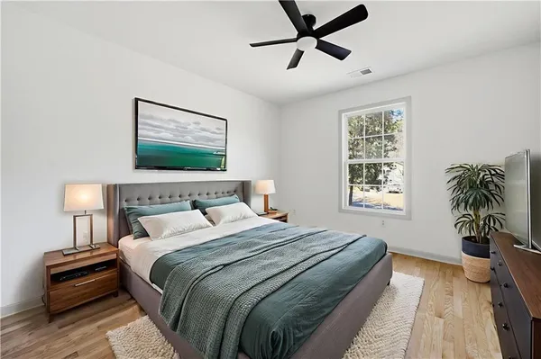 a bedroom with bed and a window