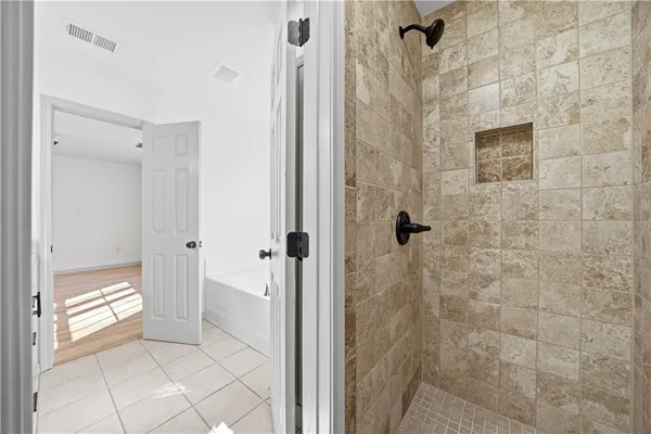 a bathroom with a granite countertop shower