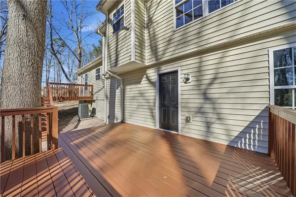 a view of outdoor space with deck and trees