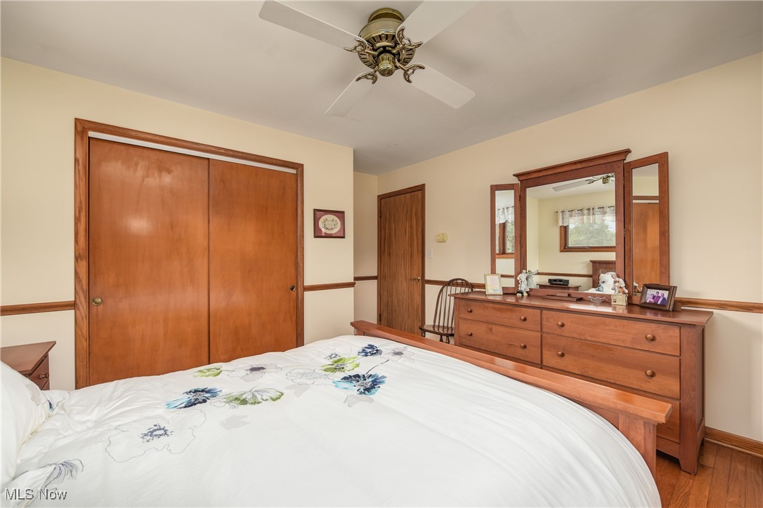 4712 Hillside Road Independence, OH 44131 - Photo 23 of 47 Bedroom featuring a closet, ceiling fan, and wood finished floors