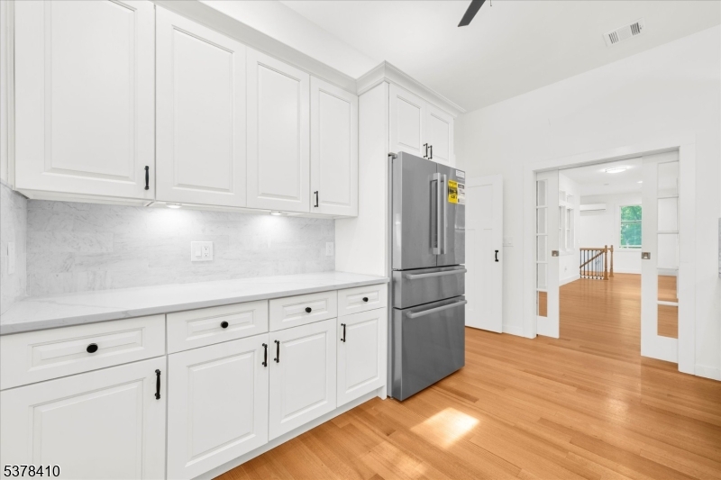 48 Norris Road Denville, NJ 07834 - Photo 11 of 33 a kitchen with cabinets and a refrigerator