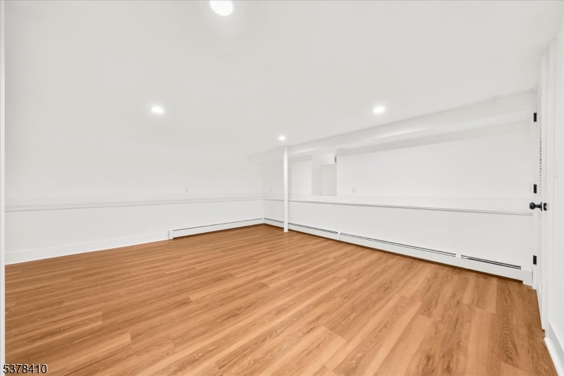 48 Norris Road Denville, NJ 07834 - Photo 24 of 33 a view of an empty room with wooden floor