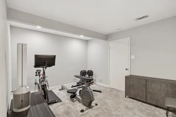 a room with a couch and a flat screen tv