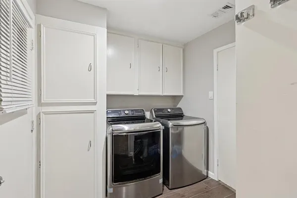 a stove top oven sitting inside of a kitchen