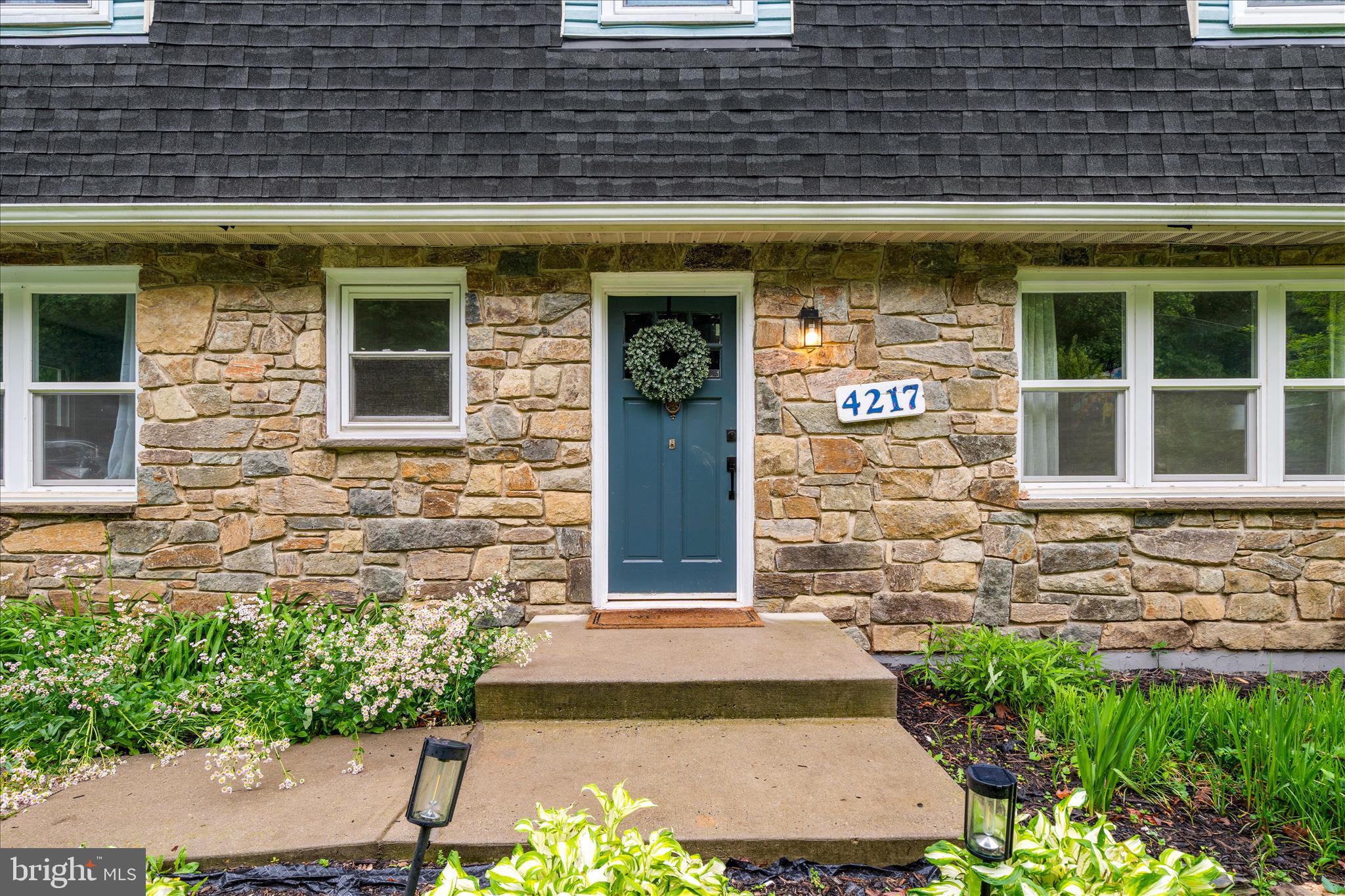 4217 Bill Moxley Road Mount Airy, MD 21771 - Photo 42 of 57 a front view of a building with a garden
