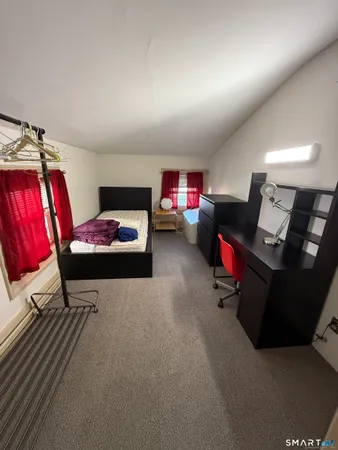 a bedroom with furniture and a bed