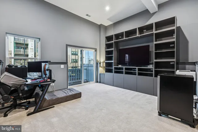 a bedroom with a bed and a desk