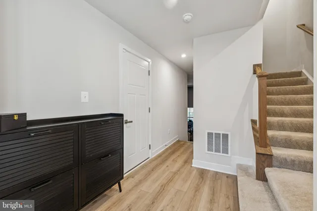 a view of wooden floor and windows in a room