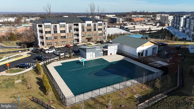 a living room with lots of furniture and clutter