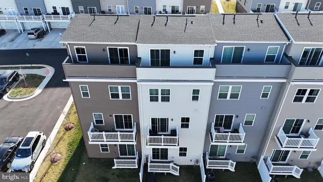 a front view of a building with many windows