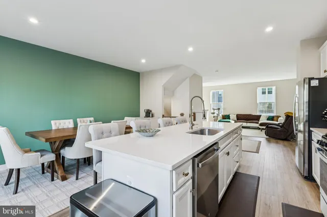 a view of a living room and dining room