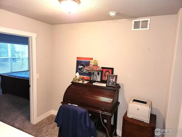 a view of a workspace with furniture