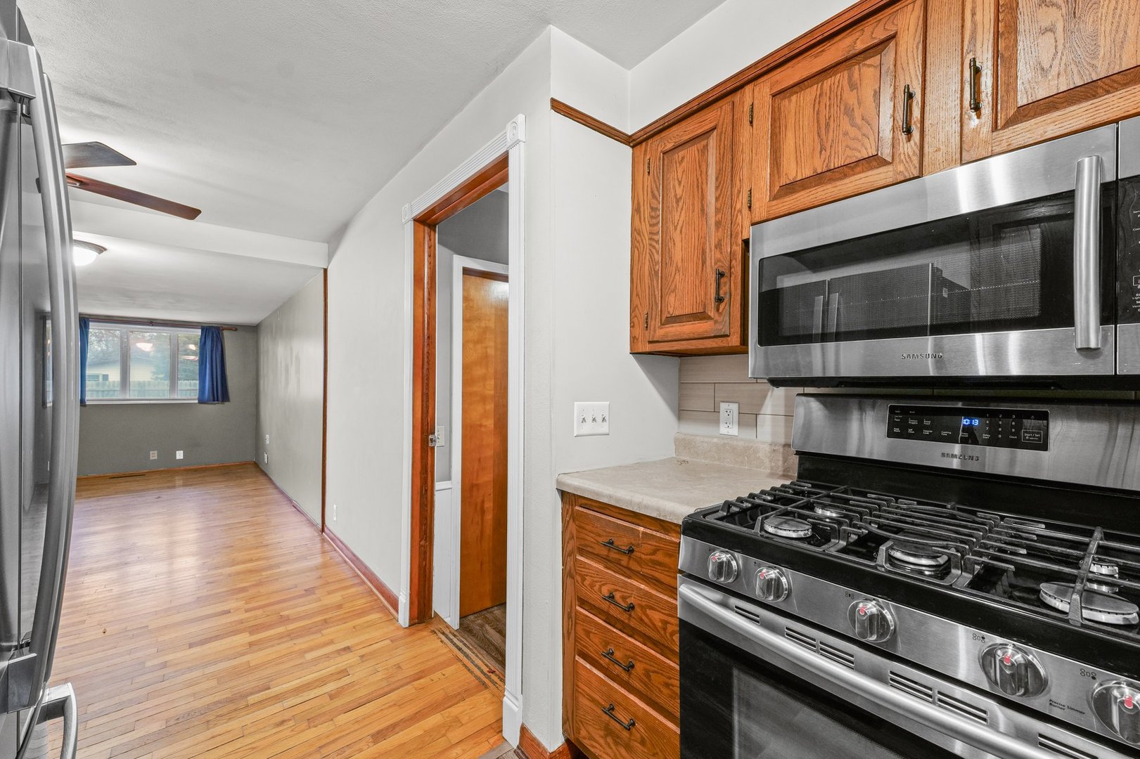 911 South Longview Road Monticello, IL 61856 - Photo 13 of 28 a kitchen with stainless steel appliances granite countertop a stove and a microwave
