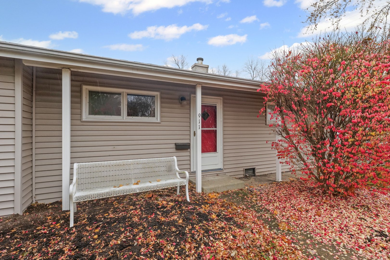 911 South Longview Road Monticello, IL 61856 - Photo 2 of 28 a view of a house with a yard and wooden fence