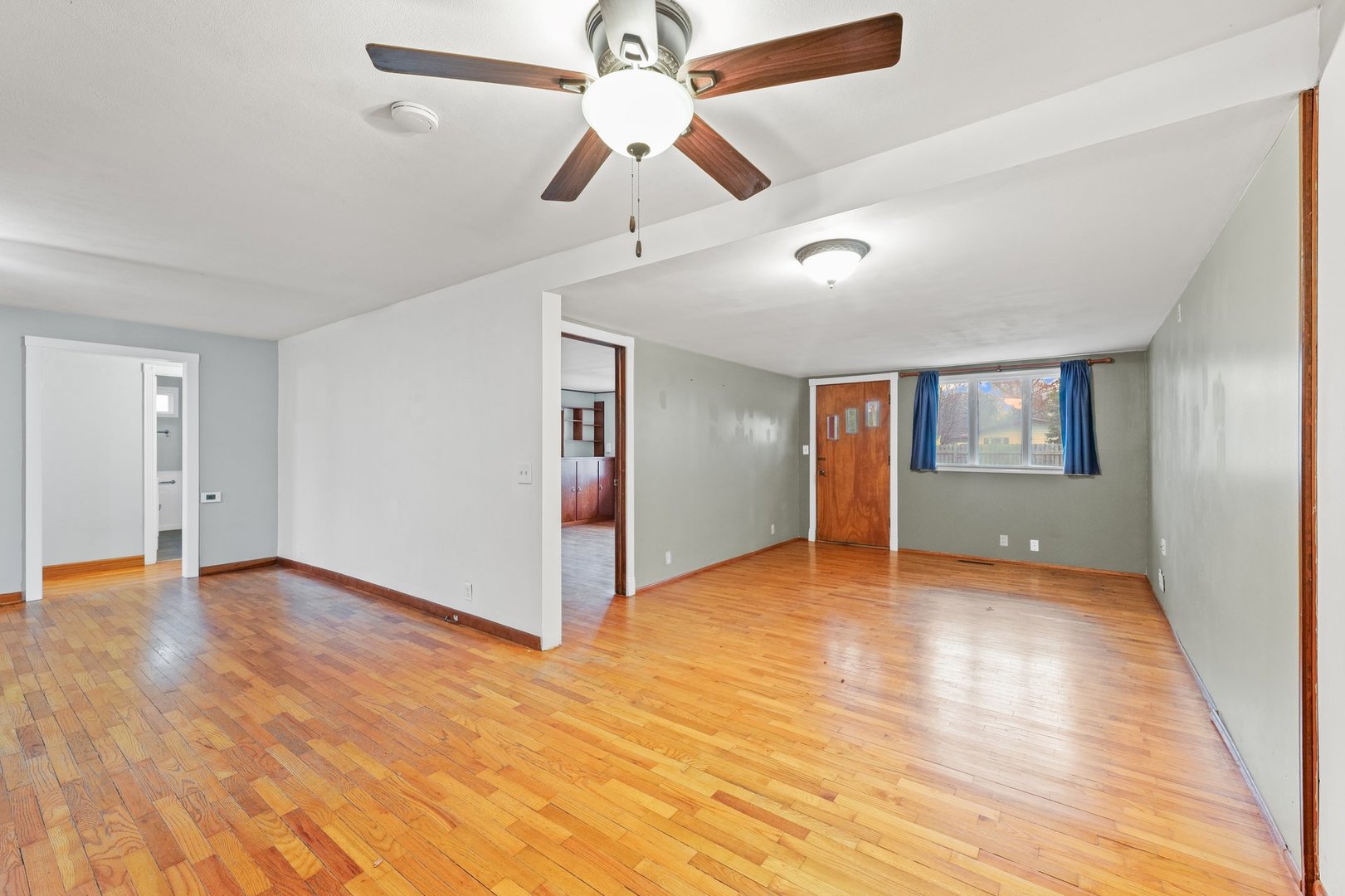911 South Longview Road Monticello, IL 61856 - Photo 8 of 28 a view of an empty room with window and wooden floor