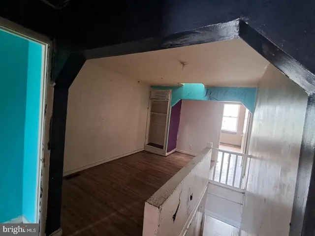 a view of staircase and living room